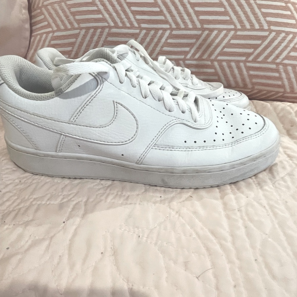 White, gently used Nike Air Force 1 tennis shoe.